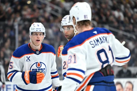 Apr 11, 2026; Los Angeles, California, USA; Edmonton Oilers defenseman Darnell Nurse (25), Edmonton Oilers center Josh Samanski (81), and Edmonton Oilers defenseman Connor Murphy (5) talk during the third period against the Los Angeles Kings at Crypto.com Arena.