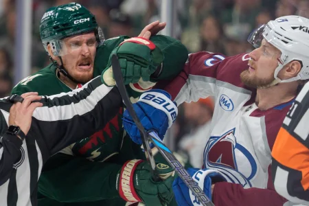May 9, 2026; Saint Paul, Minnesota, USA; Colorado Avalanche right wing Valeri Nichushkin (13) and Minnesota Wild center Michael McCarron (47) exchange words in the third period of game three of the second round of the 2026 Stanley Cup Playoffs at Grand Casino Arena.
