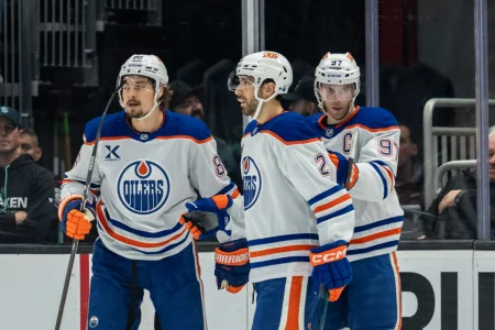 Oct 25, 2025; Seattle, Washington, USA; Edmonton Oilers, from left, forward David Tomasek (86), defenseman Evan Bouchard (2) and forward Connor McDavid (97) celebrate a goald during the second period against the Seattle Kraken at Climate Pledge Arena.