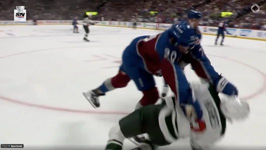 Quinn Hughes takes a brutal hit tonight and the reaction is going viral