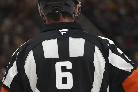 Feb 2, 2026; Pittsburgh, Pennsylvania, USA; The Fanatics logo on the sweater of referee Francis Charron (6) during the third period between the Ottawa Senators and the Pittsburgh Penguins at PPG Paints Arena.