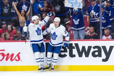 Apr 26, 2025; Ottawa, Ontario, CAN; Toronto Maple Leafscenter Auston Matthews (34) celebrates with left wing Matthew Knies (23) his goal scored in the second period against the Ottawa Senators in game four of the first round of the 2025 Stanley Cup Playoffs at Canadian Tire Centre.