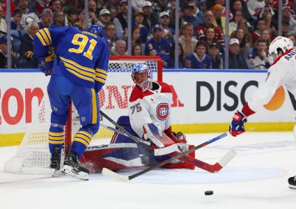 May 14, 2026; Buffalo, New York, USA; Montréal Canadiens goaltender Jakub Dobes (75) makes a save on Buffalo Sabres right wing Josh Doan (91) during the second period in game five of the second round of the 2026 Stanley Cup Playoffs at KeyBank Center.