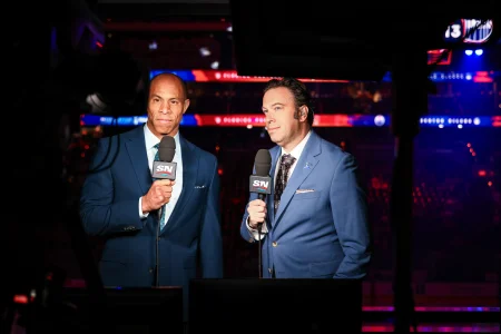 Jun 14, 2025; Edmonton, Alberta, CAN; Sportsnet host David Amber (left) and NHL Insider Elliotte Friedman (right) prior to the game between the Edmonton Oilers and the Florida Panthers in game five of the 2025 Stanley Cup Final at Rogers Place.