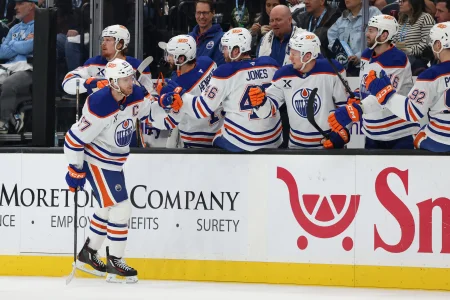 Apr 7, 2026; Salt Lake City, Utah, USA; Edmonton Oilers center Connor McDavid (97) celebrates with the bench player after scoring a goal against the Utah Mammoth during the first period at Delta Center.