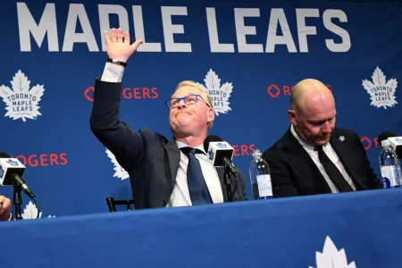May 4, 2026; Toronto, Ontario, CANADA; Maple Leaf Sports and Entertainment CEO Keith Pelley waves to spectators after holding an introductory media conference to introduce new general manager John Chayka (not shown) and senior executive advisor Mats Sundin (right) at Real Sports Bar and Grill.