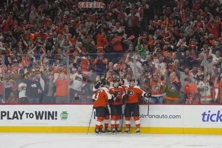 May 9, 2026; Philadelphia, Pennsylvania, USA; Philadelphia Flyers left wing Alex Bump (20) celebrates a goal teammates against the Carolina Hurricanes in game four of the second round of the 2026 Stanely Cup Playoffs at Xfinity Mobile Arena.
