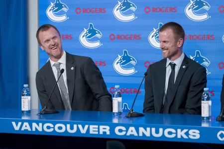 May 14, 2026; Vancouver, BC, Canada; The Vancouver Canucks promoted Henrik Sedin (left) and his twin brother Daniel Sedin (center) to co-presidents during a press conference at Rogers Arena.