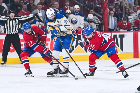 May 16, 2026; Montreal, Quebec, CAN; Montreal Canadiens center Kirby Dach (77) and defenseman Alexandre Carrier (45) defend the puck against Buffalo Sabres right wing Alex Tuch (89) during the third period in game six of the second round of the 2026 Stanley Cup Playoffs at Bell Centre.