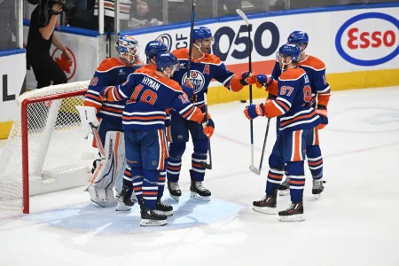 Apr 9, 2025; Edmonton, Alberta, CAN; Edmonton Oilers goalie Calvin Pickard (30) celebrates with defenseman Darnell Nurse (25), left wing Zach Hyman (18) and center Connor McDavid (97) after defeating the St. Louis Blues at Rogers Place.