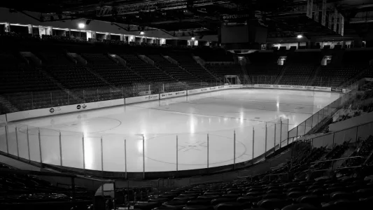 Empty hockey arena black and white