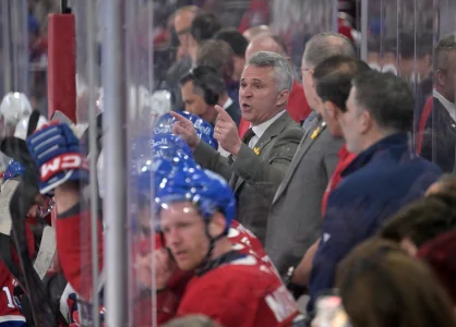 Apr 7, 2026; Montreal, Quebec, CAN; Montreal Canadiens head coach Martin St-Louis talks to players during a time out during the third period of the game against the Florida Panthers at the Bell Centre.