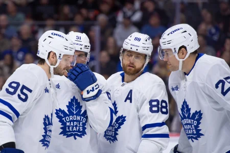 Mar 21, 2026; Ottawa, Ontario, CAN; Toronto Maple Leafs defenseman Pillippe Myers (51) speaks with defenseman Oliver Ekman-Larsson (95) and right wing William Nylander (88) and defenseman Brandon Carlo (25) in the first period against the Ottawa Senators at the Canadian Tire Centre.