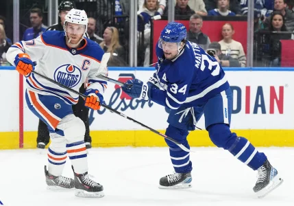Mar 11, 2023; Toronto, Ontario, CAN; Toronto Maple Leafs center Auston Matthews (34) battles with Edmonton Oilers center Connor McDavid (97) during the first period at Scotiabank Arena.