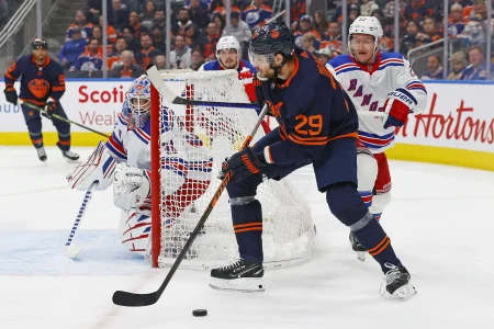 Feb 17, 2023; Edmonton, Alberta, CAN; Edmonton Oilers forward Leon Draisaitl (29) looks to make a pass from behind New York Rangers goaltender Igor Shesterkin (31) during the third period at Rogers Place.