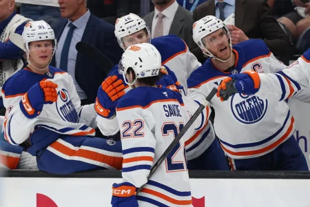 Mar 24, 2026; Salt Lake City, Utah, USA; Edmonton Oilers center Matt Savoie (22) celebrates scoring a goal against the Utah Mammoth with bench players during the second period at Delta Center.