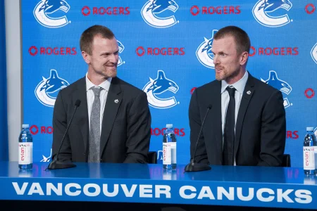 May 14, 2026; Vancouver, BC, Canada; The Vancouver Canucks promoted Henrik Sedin (left) and his twin brother Daniel Sedin (right) to co-presidents during a press conference at Rogers Arena.