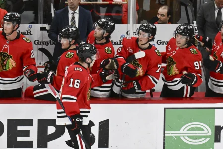 Awkward bench-door hit gives Chicago Blackhawks a scare as former 3rd-overall pick exits injured
