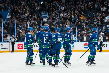Apr 14, 2026; Vancouver, British Columbia, CAN; The Vancouver Canucks celebrate their victory against the Los Angeles Kings at Rogers Arena.