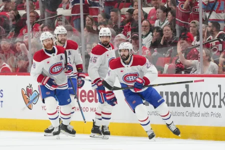 May 21, 2026; Raleigh, North Carolina, USA; Montreal Canadiens center Phillip Danault (24) celebrates with teammates after scoring a goal against the Carolina Hurricanes during the first period in game one of the Eastern Conferene Final of the 2026 Stanley Cup Playoffs at Lenovo Center.