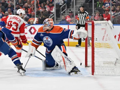 Dec 11, 2025; Edmonton, Alberta, CAN; Edmonton Oilers goalie Stuart Skinner (74) and Detroit Red Wings right winger Alex DeBrincat (93) are seen out on the ice during the second period at Rogers Place.