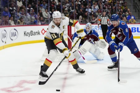 Apr 8, 2025; Denver, Colorado, USA; Vegas Golden Knights right wing Mark Stone (61) passes the puck away from Colorado Avalanche defenseman Cale Makar (8) in the first period at Ball Arena.