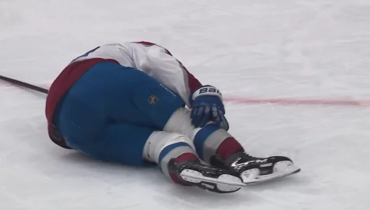 Nathan MacKinnon limps down tunnel after brutal shot block