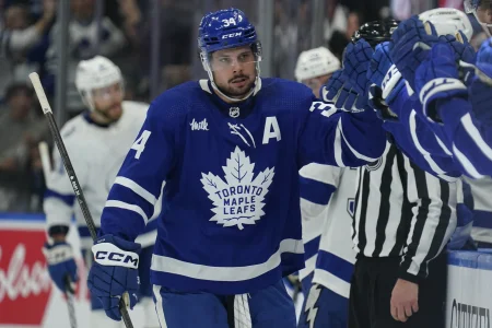 Apr 3, 2024; Toronto, Ontario, CAN; Toronto Maple Leafs forward Auston Matthews (34) gets congratulated after scoring against the Tampa Bay Lightning during the first period at Scotiabank Arena.