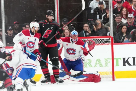 May 23, 2026; Raleigh, North Carolina, USA; Montréal Canadiens goaltender Jakub Dobes (75) makes a save during the second period against the Carolina Hurricanes in game two of the Eastern Conferene Final of the 2026 Stanley Cup Playoffs at Lenovo Center.
