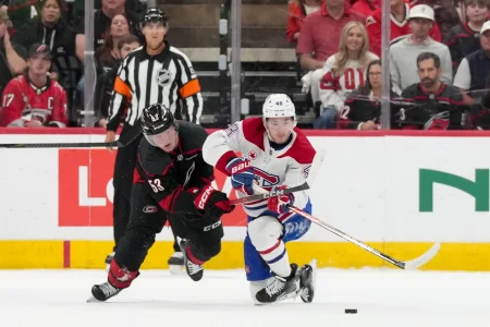 May 21, 2026; Raleigh, North Carolina, USA; Carolina Hurricanes right wing Jackson Blake (53) challenges Montreal Canadiens defenseman Lane Hutson (48) for the puck during the second period in game one of the Eastern Conferene Final of the 2026 Stanley Cup Playoffs at Lenovo Center.