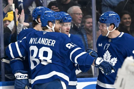 Feb 28, 2026; Toronto, Ontario, CAN; Toronto Maple Leafs defenseman Morgan Rielly (44) celebrates with team mates after scoring a goal against the Ottawa Senators in the first period at Scotiabank Arena.