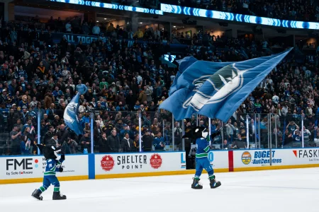 Apr 14, 2026; Vancouver, British Columbia, CAN; Fin the mascot and the Vancouver Canucks celebrate their victory against the Los Angeles Kings at Rogers Arena.