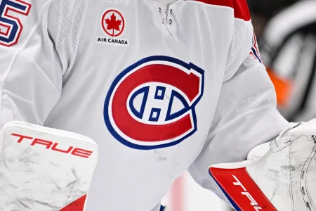 Jan 4, 2026; Dallas, Texas, USA; A view of the logo on the jersey of Montreal Canadiens goaltender Sam Montembeault (35) during the game between the Stars and the Canadiens at the American Airlines Center.