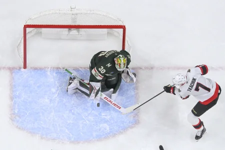 Dec 13, 2025; Saint Paul, Minnesota, USA; Minnesota Wild goalie Jesper Wallstedt (30) makes a save on Ottawa Senators forward Brady Tkachuk (7) during the second period at Grand Casino Arena.