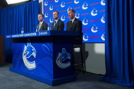 May 14, 2026; Vancouver, BC, Canada; The Vancouver Canucks promoted Henrik Sedin (left), his twin brother Daniel Sedin (center) to co-presidents and Ryan Johnson (right) was named the Canucks new general manger during a press conference at Rogers Arena.