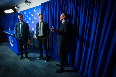 May 14, 2026; Vancouver, BC, Canada; Daniel Sedin and Henrik Sedin and Ryan Johnson smile after a press conference where the Vancouver Canucks name new senior management staff. Henrik Sedin and his twin brother Daniel Sedin have been appointed as co-presidents of hockey operations and Ryan Johnson is now the new general manager of the club at Rogers Arena.