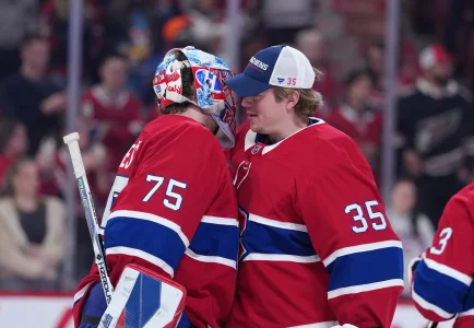 Feb 28, 2026; Montreal, Quebec, CAN; Montreal Canadiens goalie Jakub Dobes (75) celebrates the win against the Washington Capitals with teammate goalie Sam Montembeault (35) at the Bell Centre. Mandatory Credit: Eric Bolte-Imagn Images