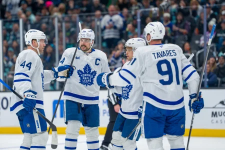 Jan 29, 2026; Seattle, Washington, USA; Toronto Maple Leafs, from left, defenseman Morgan Rielly (44), forward Auston Matthews (34), forward Max Domi (11) and forward John Tavares (91) celebrate a goal during the third period at Climate Pledge Arena.