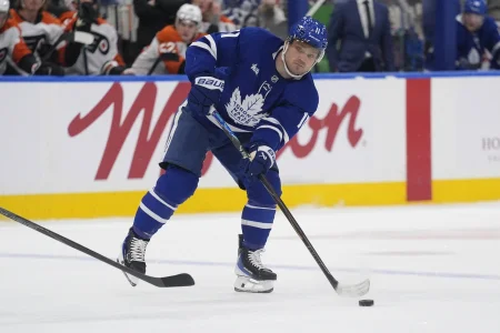 Mar 2, 2026; Toronto, Ontario, CAN; Toronto Maple Leafs forward Max Domi (11) passes the puck against the Philadelphia Flyers during the first period at Scotiabank Arena.