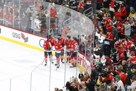 Mar 22, 2026; Chicago, Illinois, USA; Chicago Blackhawks center Connor Bedard (98) celebrates with teammates after scoring against the Nashville Predators during the second period at United Center.