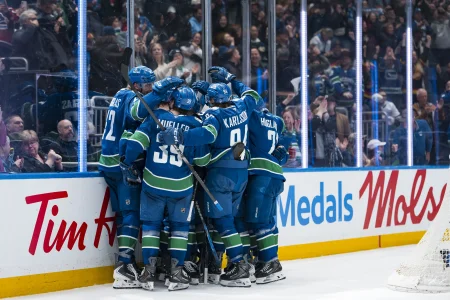 Apr 14, 2026; Vancouver, British Columbia, CAN; The Vancouver Canucks celebrate their victory against the Los Angeles Kings in overtime at Rogers Arena.