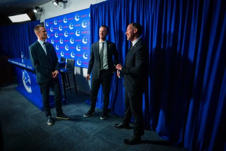 May 14, 2026; Vancouver, BC, Canada; Daniel Sedin and Henrik Sedin and Ryan Johnson smile after a press conference where the Vancouver Canucks name new senior management staff. Henrik Sedin and his twin brother Daniel Sedin have been appointed as co-presidents of hockey operations and Ryan Johnson is now the new general manager of the club at Rogers Arena.
