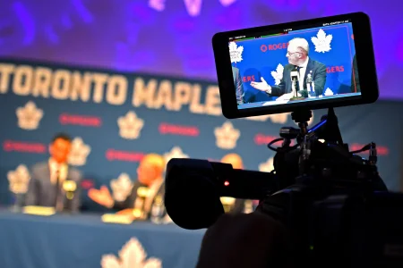 May 4, 2026; Toronto, Ontario, CANADA; Maple Leaf Sport and Entertainment CEO Keith Pelley is shown on a video camera monitor as he introduces the Toronto Maple Leafs new general manager John Chayka during an introductory news conference at Real Sports Bar and Grill.