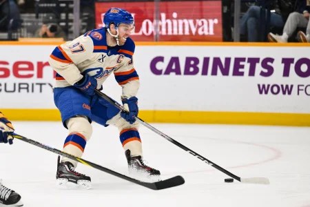 Jan 13, 2026; Nashville, Tennessee, USA; Edmonton Oilers center Connor McDavid (97) takes a shot on goal against the Nashville Predators during the second period at Bridgestone Arena.