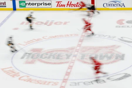 Mar 4, 2026; Detroit, Michigan, USA; Players skate across the Red Wings logo in the first period of the game between the Detroit Red Wings and the Florida Panthers at Little Caesars Arena.