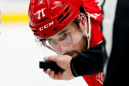 Apr 7, 2026; Detroit, Michigan, USA; Detroit Red Wings center Dylan Larkin (71) gets set to face off Columbus Blue Jackets center Charlie Coyle (3) in the second period at Little Caesars Arena.