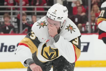 Jun 4, 2026; Raleigh, North Carolina, USA; Vegas Golden Knights defenseman Brayden McNabb (3) reacts to a puck to the face during the first period against the Carolina Hurricanes in game two of the 2026 Stanley Cup Final at Lenovo Center.