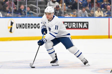 Mar 28, 2026; St. Louis, Missouri, USA; Toronto Maple Leafs center Max Domi (11) controls the puck against the St. Louis Blues during the first period at Enterprise Center.