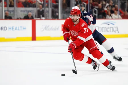 Apr 7, 2026; Detroit, Michigan, USA; Detroit Red Wings center Dylan Larkin (71) skates with the puck in overtime against the Columbus Blue Jackets at Little Caesars Arena.