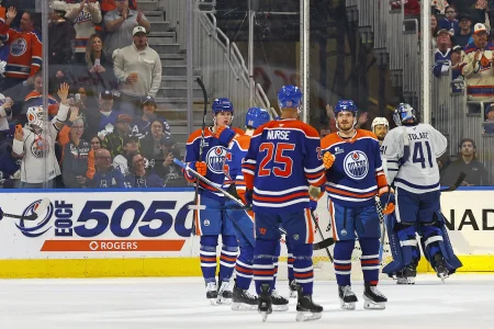 Feb 3, 2026; Edmonton, Alberta, CAN; The Edmonton Oilers celebrate a goal scored by defensemen Jake Wahlman (96) during the second period against the Toronto Maple Leafs at Rogers Place.